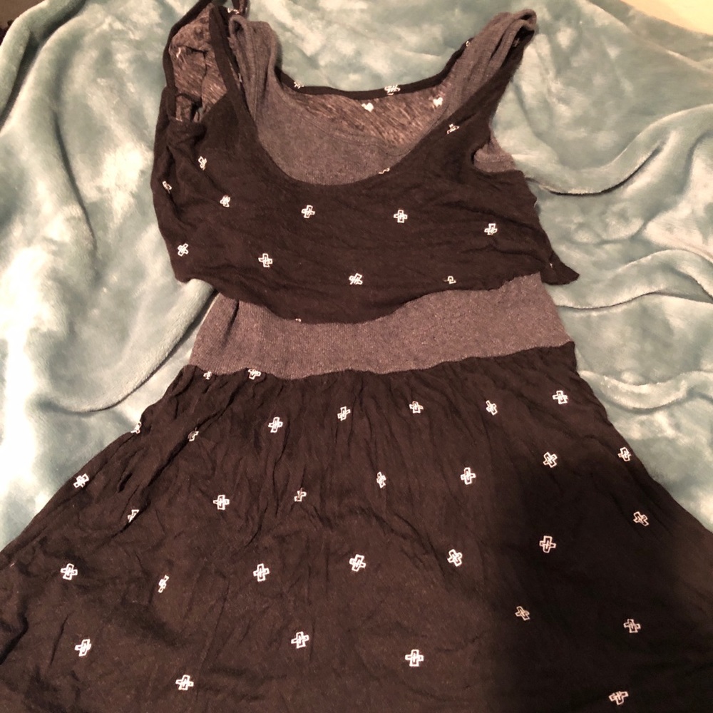 Black, stretchy skater dress with cross detail